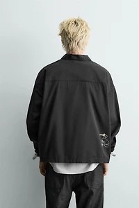 EMBROIDERED ZIP POLO SHIRT
