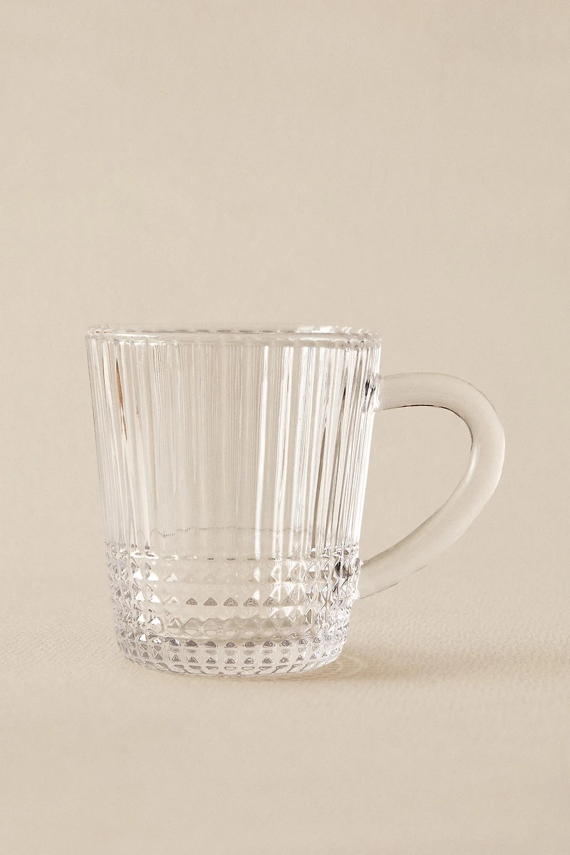GLASS MUG WITH A RAISED GEOMETRIC DESIGN