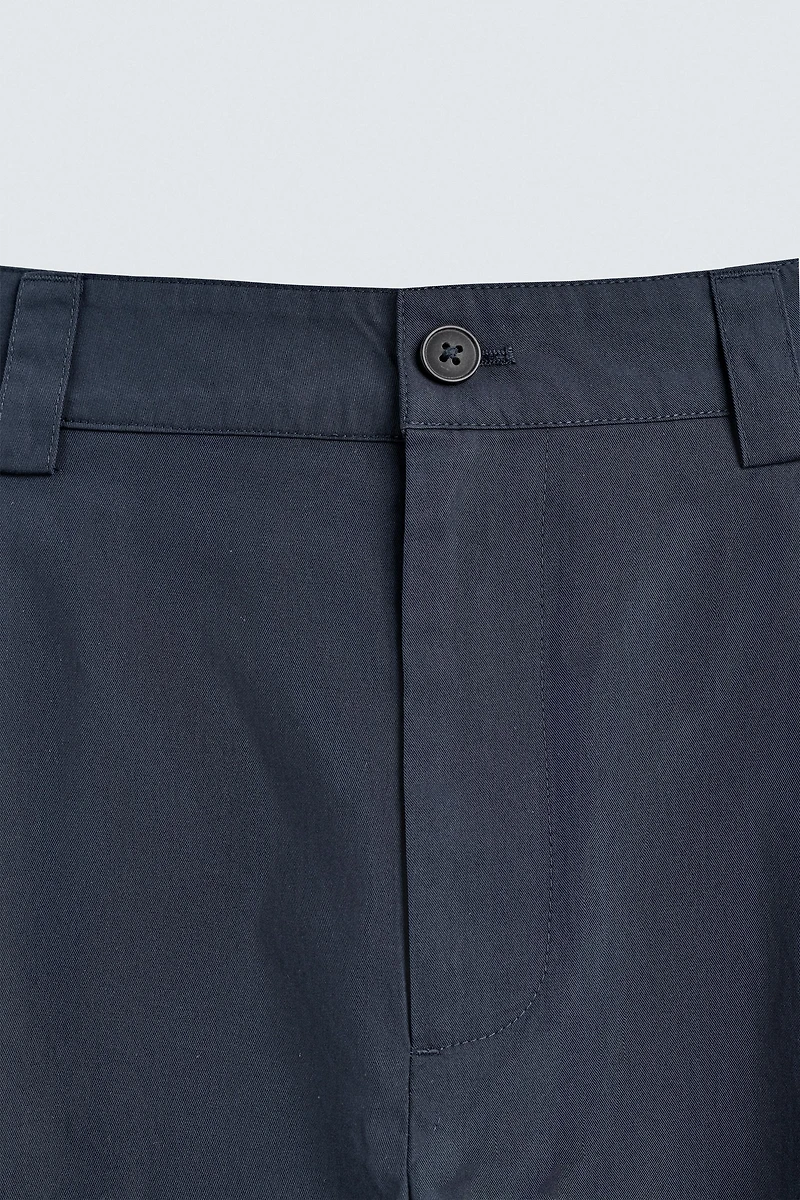 RELAXED FIT PLEATED PANTS
