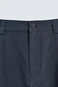 RELAXED FIT PLEATED PANTS