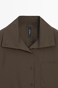 High collar overshirt with buckle detail