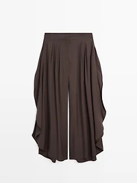 Pantalon large plissé à fentes latérales