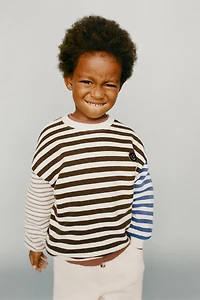STRIPED SWEATSHIRT WITH FACE PATCH