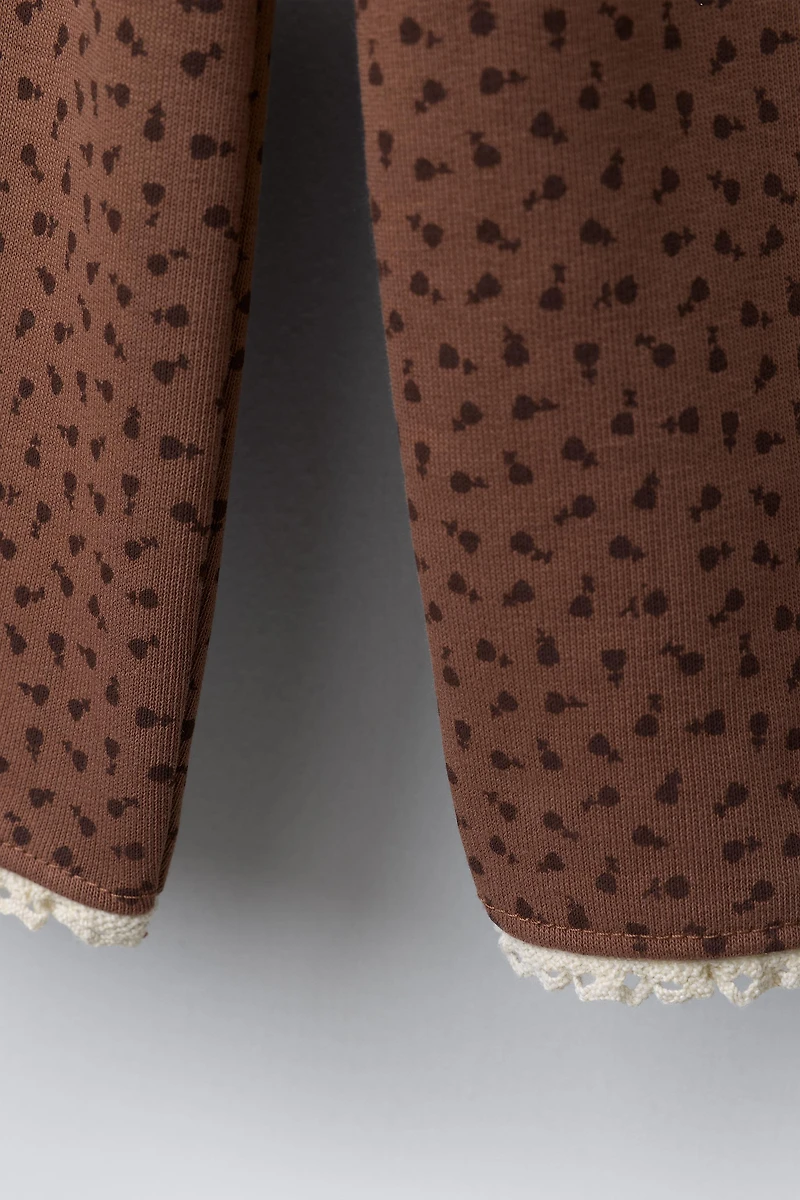 PANTALON EN MOLLETON JUPE-CULOTTE IMPRIMÉ DENTELLE