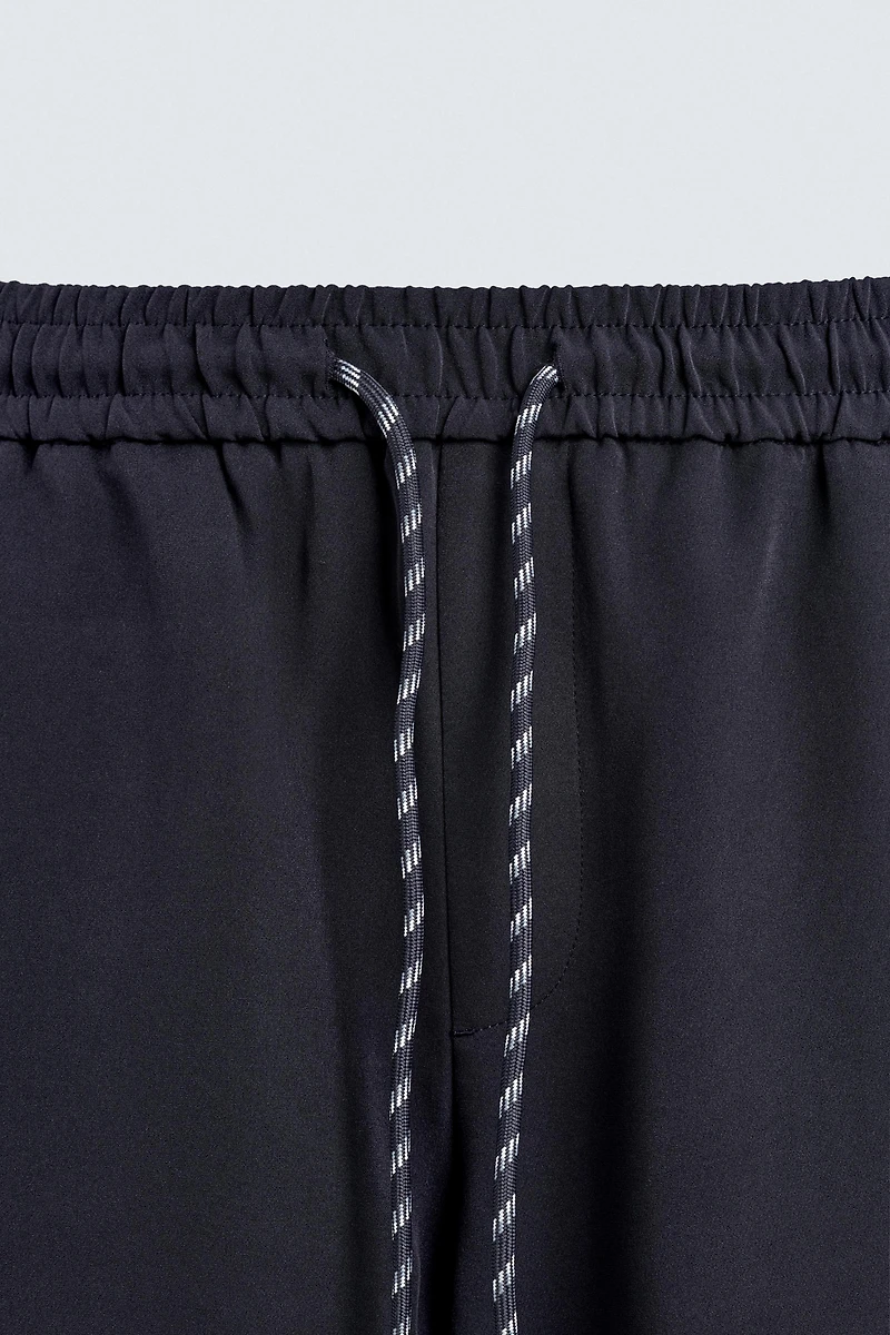 WIDE FIT JOGGER PANTS WITH SIDE STRIPES