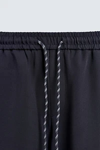 WIDE FIT JOGGER PANTS WITH SIDE STRIPES