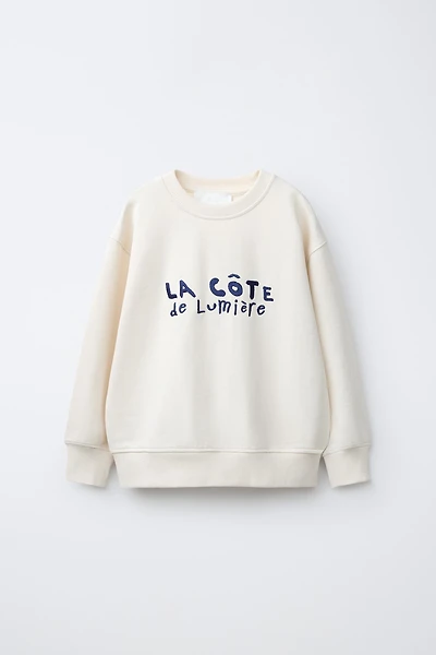 SWEAT À INSCRIPTION BRODÉE