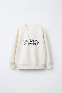 SWEAT À INSCRIPTION BRODÉE