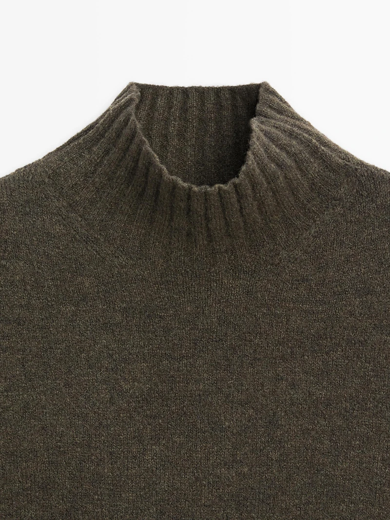 Sleeveless high neck sweater