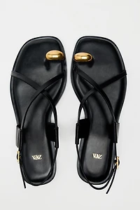 FLAT SANDALS WITH METALLIC DETAIL