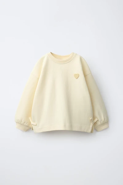 INTERLOCK BOW AND HEART SWEATSHIRT