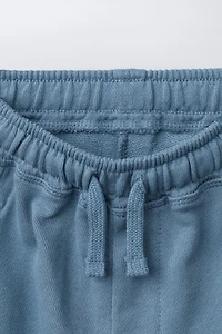 PANTALON BARREL EN MOLLETON AVEC ÉTIQUETTE