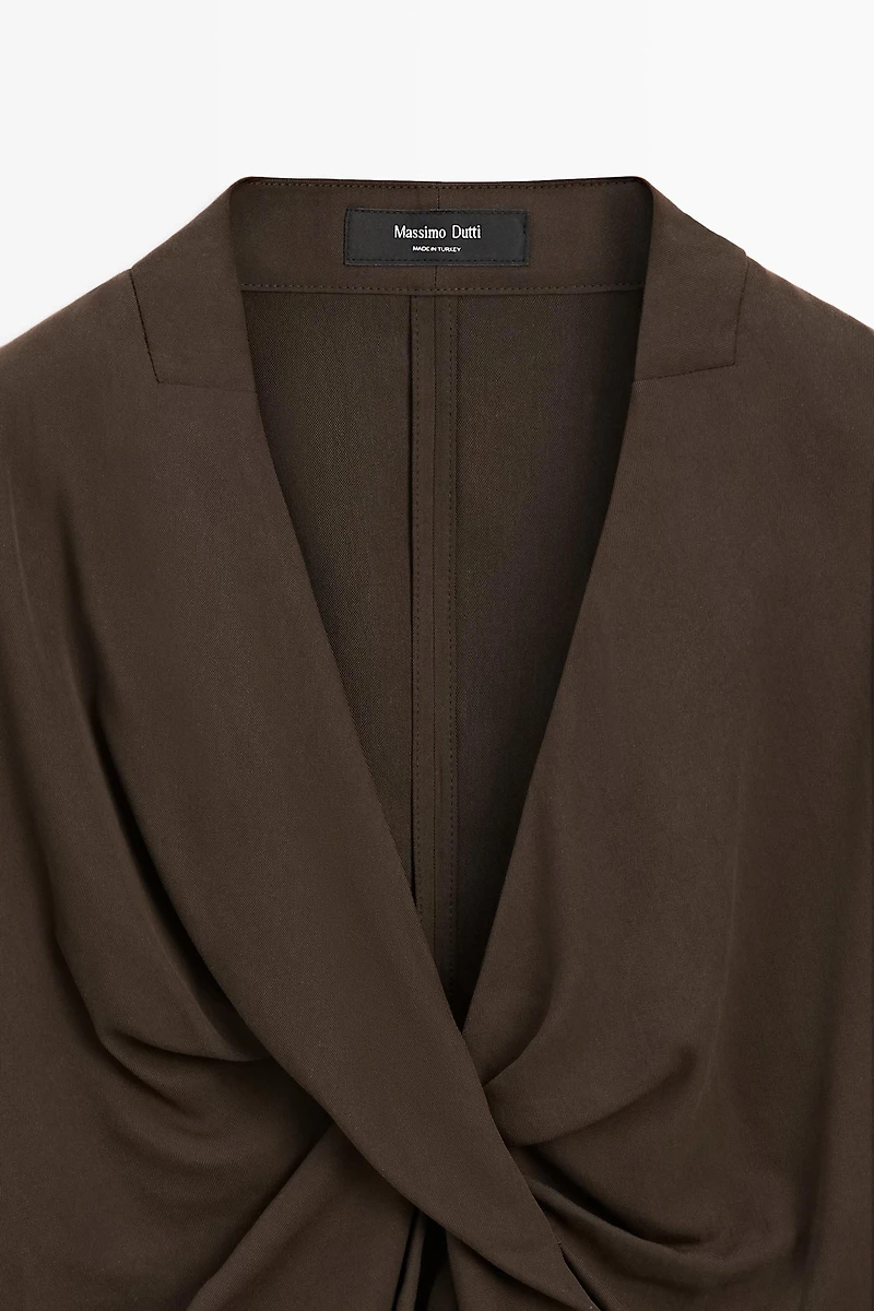 Flowing blouse with draped detail