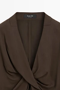 Flowing blouse with draped detail