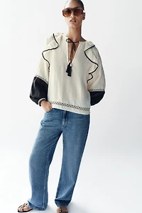 VOLUMINOUS RUFFLE BLOUSE