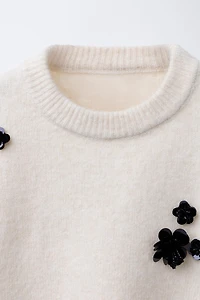 PULL EN MAILLE FLEURS PAILLETTES