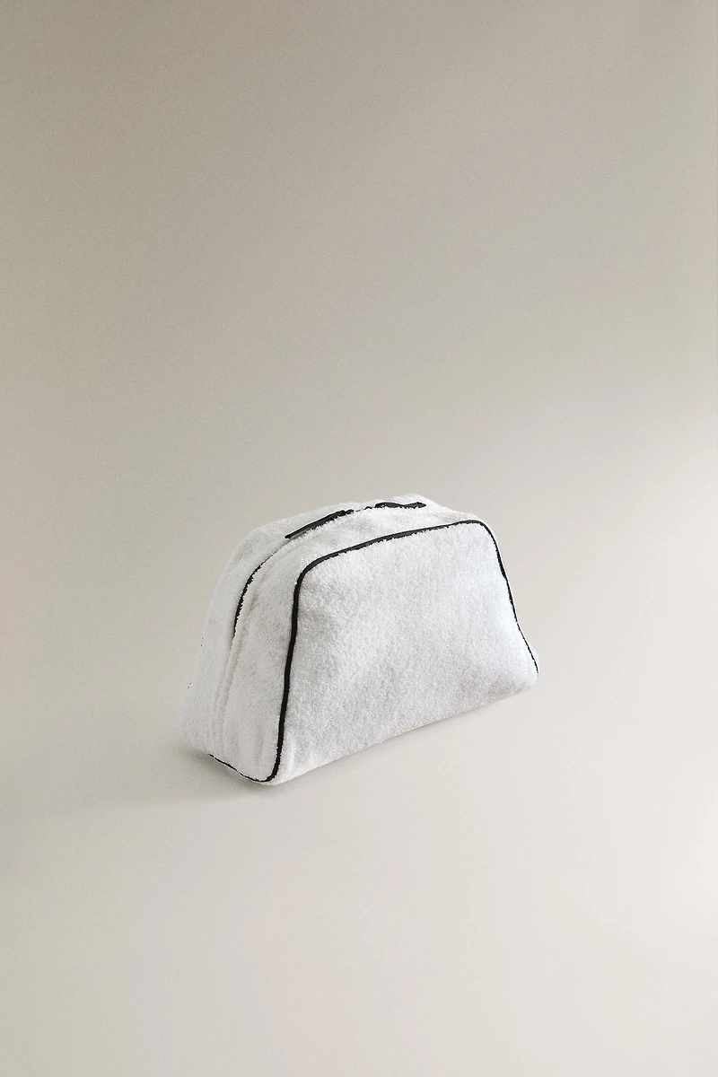 TERRY CLOTH TOILETRY BAG WITH PIPING DETAIL