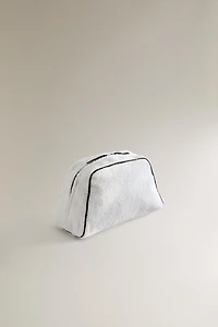 TERRY CLOTH TOILETRY BAG WITH PIPING DETAIL