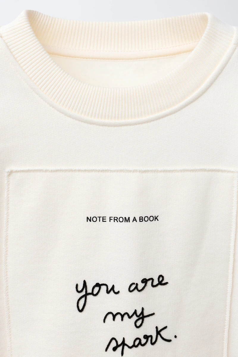 PATCH AND FLOCKED TEXT SWEATSHIRT