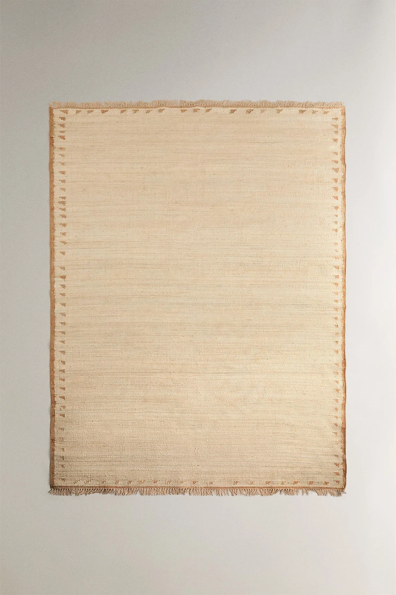 JUTE AND COTTON AREA RUG WITH FRINGING