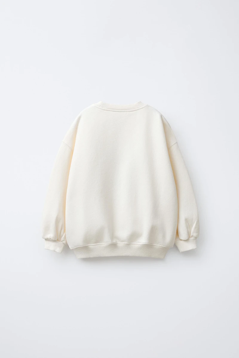 FAUX SHEARLING REINDEER PATCH SWEATSHIRT