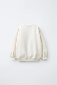 FAUX SHEARLING REINDEER PATCH SWEATSHIRT