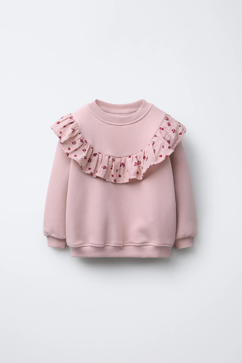 SWEAT À VOLANTS ET FLEURS