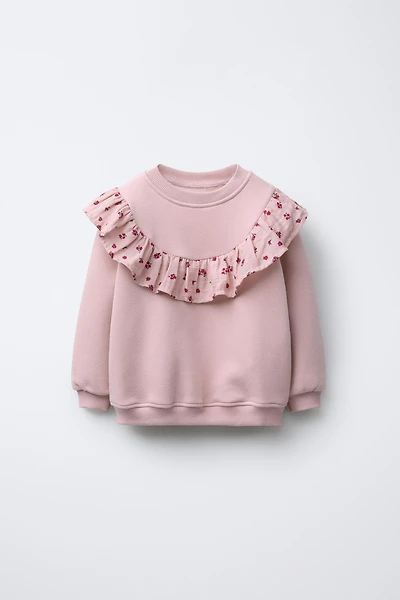 SWEAT À VOLANTS ET FLEURS