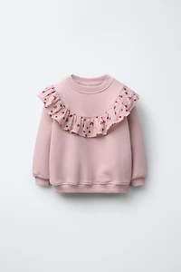 SWEAT À VOLANTS ET FLEURS