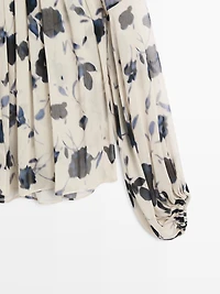 Asymmetric flowing floral print blouse