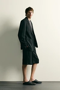 TEXTURED PLEATED SUIT SHORTS