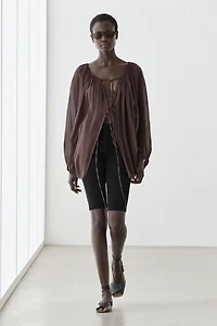 Flowing shirt with gathered details