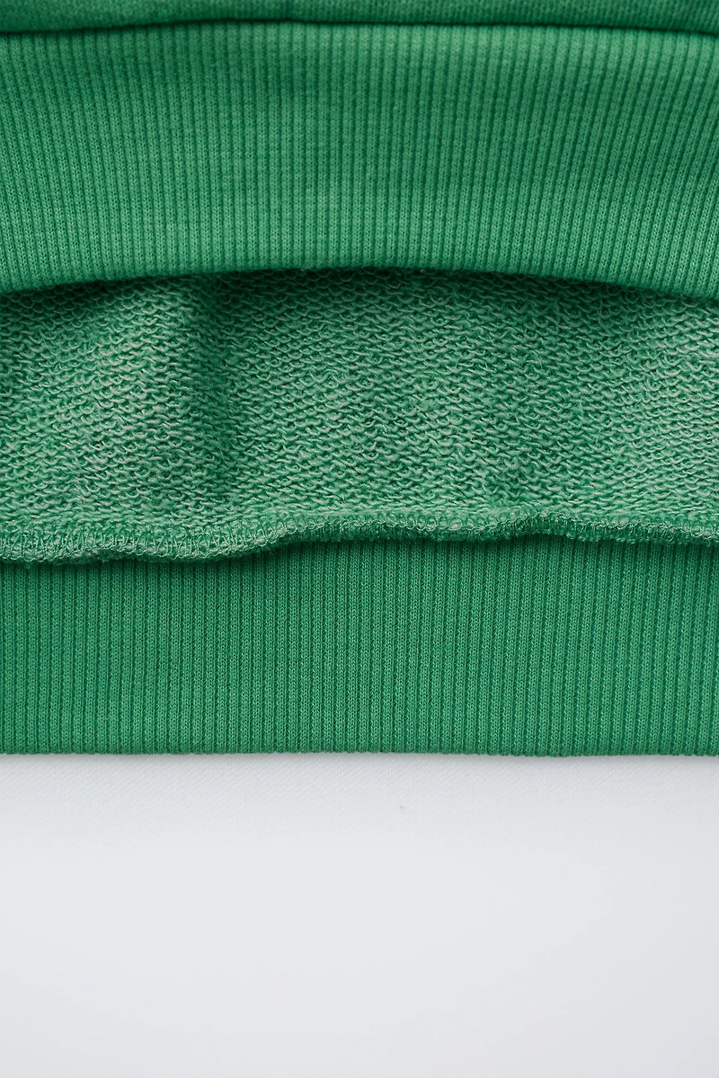 SWEAT À INSCRIPTION ET BANDES EN CONTRASTE
