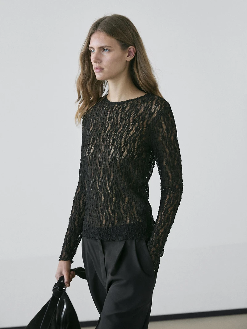 Openwork knit top with long sleeves and lace