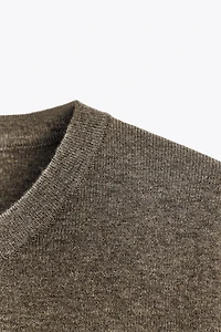 TOP EN MAILLE MANCHES COURTES AU TOUCHER DOUX