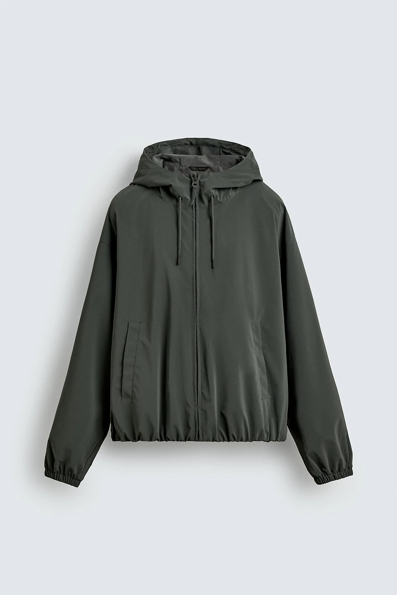 VESTE TECHNIQUE À CAPUCHE