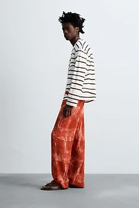 GRAPHIC PRINT KNIT PANTS © OTIS KWAME KYE QUAICOE