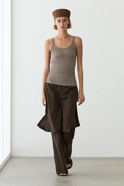 Flowing trousers with skirt detail