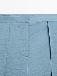 Flowing palazzo trousers with slits