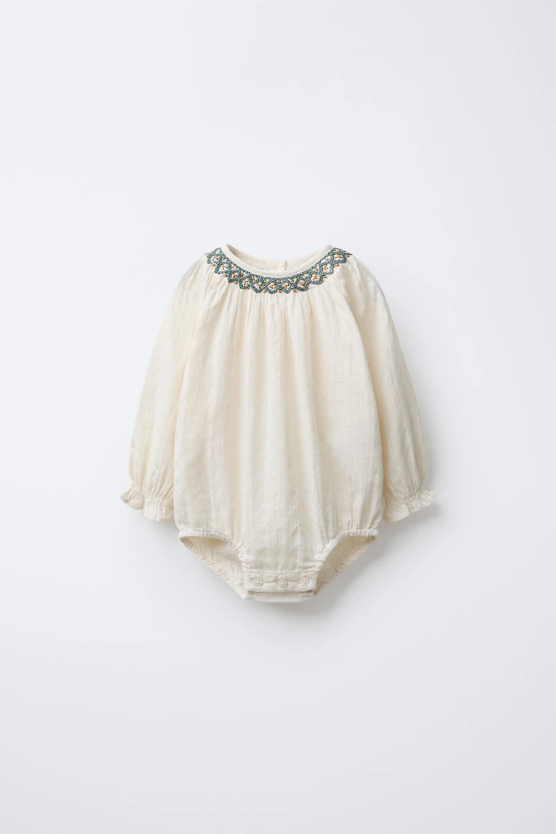 CONTRAST EMBROIDERED BODYSUIT