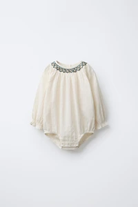 CONTRAST EMBROIDERED BODYSUIT