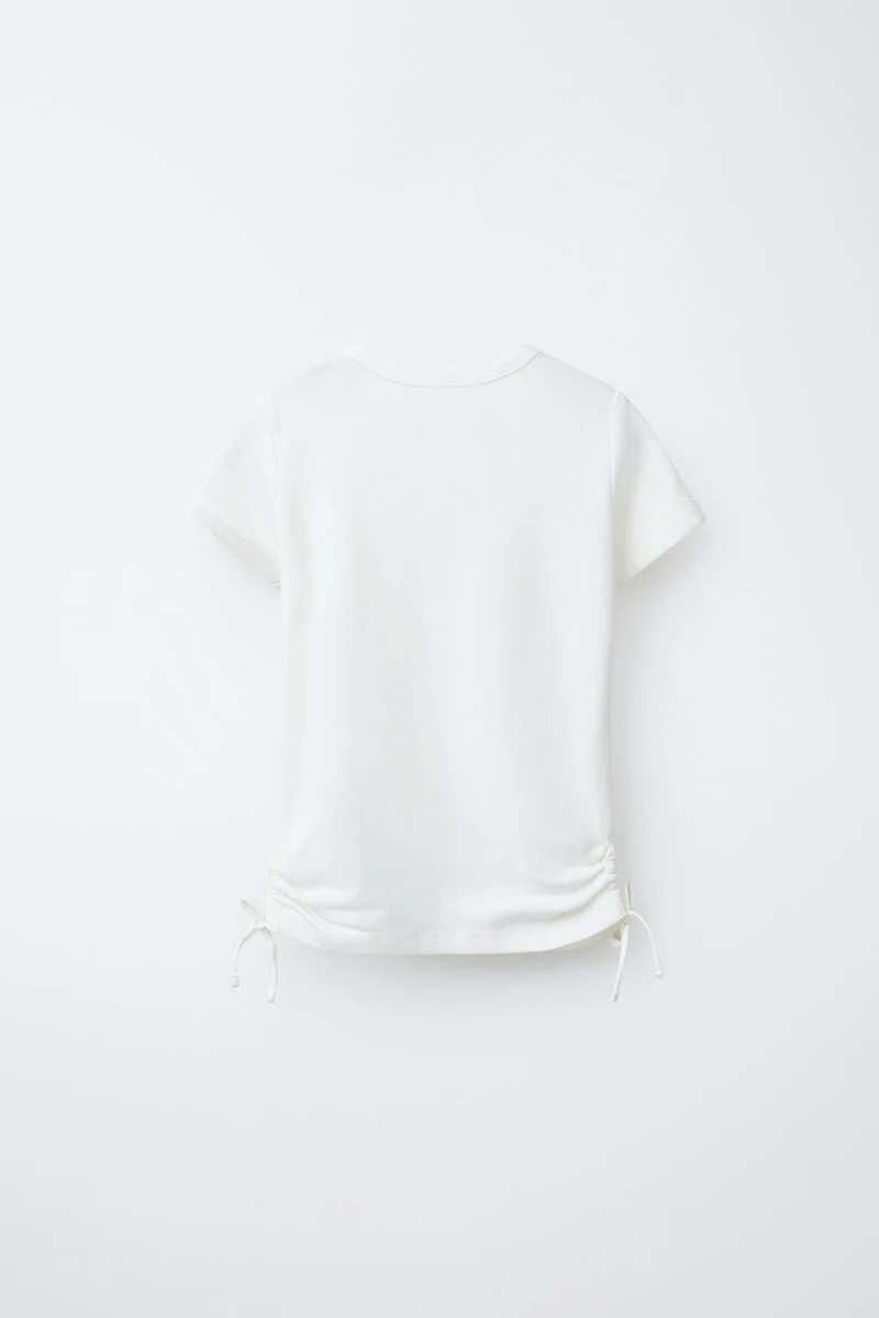 MODAL T-SHIRT WITH CUT OUTS AND BOWS