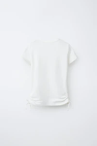 MODAL T-SHIRT WITH CUT OUTS AND BOWS