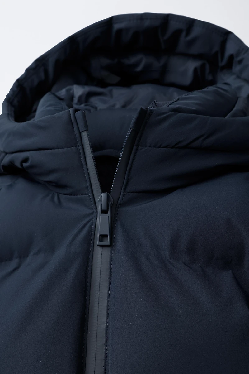 BLOUSON MATELASSÉ À CAPUCHE DÉPERLANT