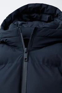 BLOUSON MATELASSÉ À CAPUCHE DÉPERLANT