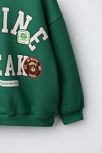 TEXT AND BEAR PATCH SWEATSHIRT