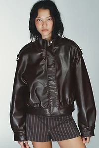 BLOUSON EN MATIÈRE SYNTHÈTIQUE AVEC PATTES