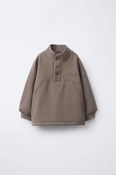 RAISED TEXT AND LOGO SWEATSHIRT