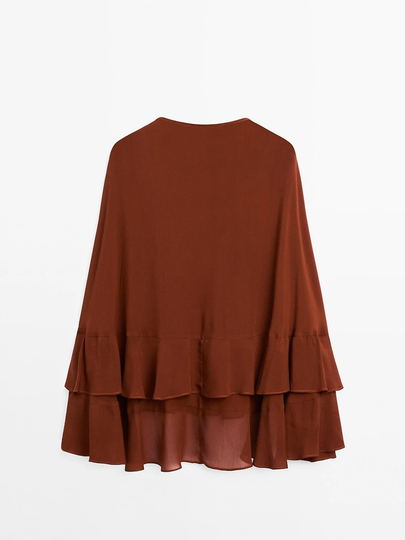 Cape-style blouse with ruffles