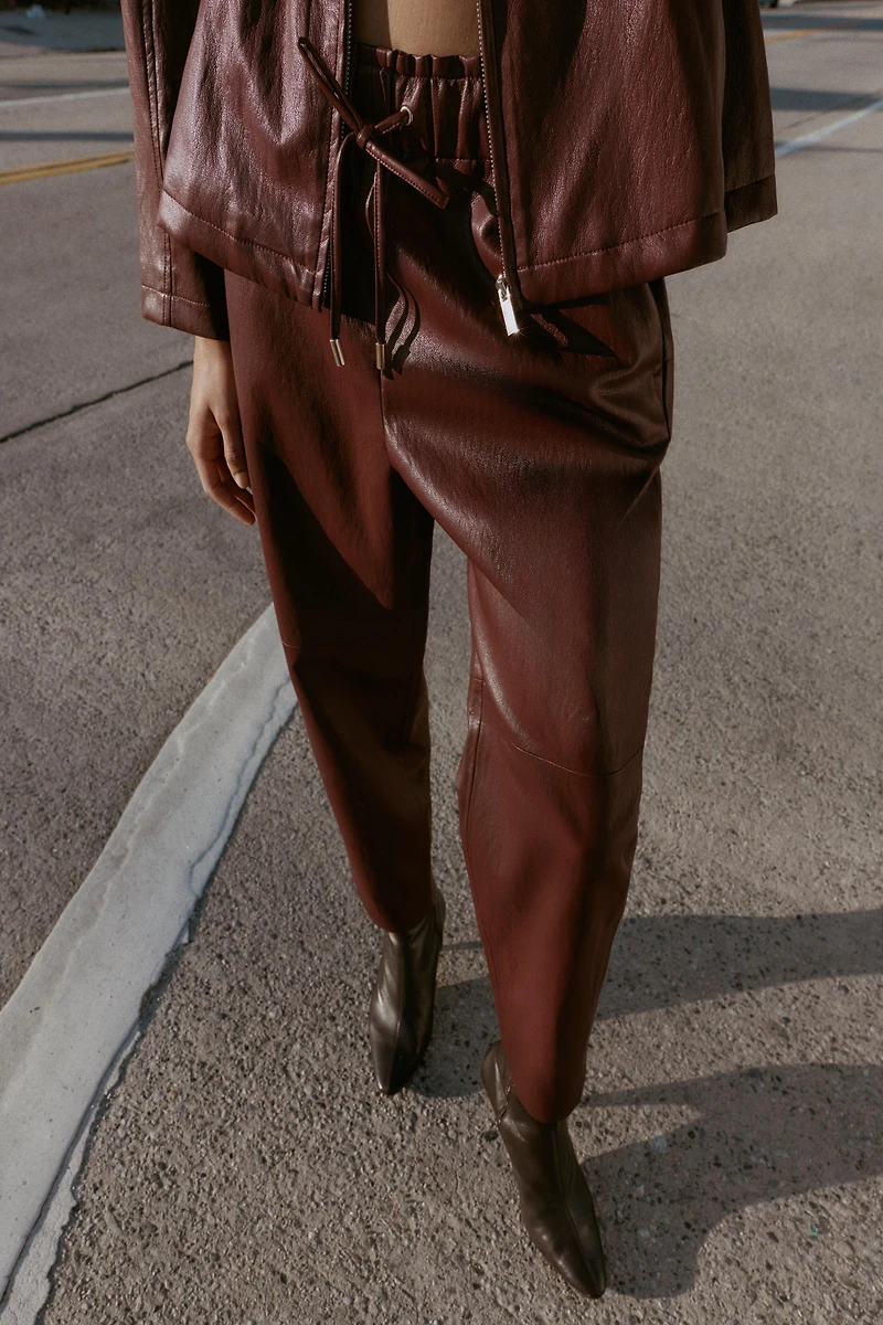 FAUX LEATHER ELASTIC WAIST PANTS